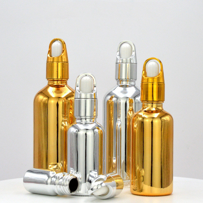 Customized Accepted Essential Oil Small Round Empty Shiny Silver Gold Dropper Oil Bottle with Unique Flower Basket Rubber
